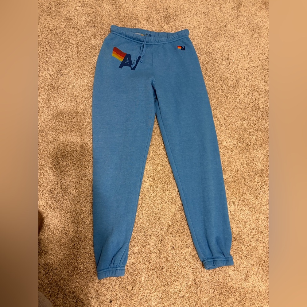 Aviator Nation Blue Track Joggers with Rainbow Logo
